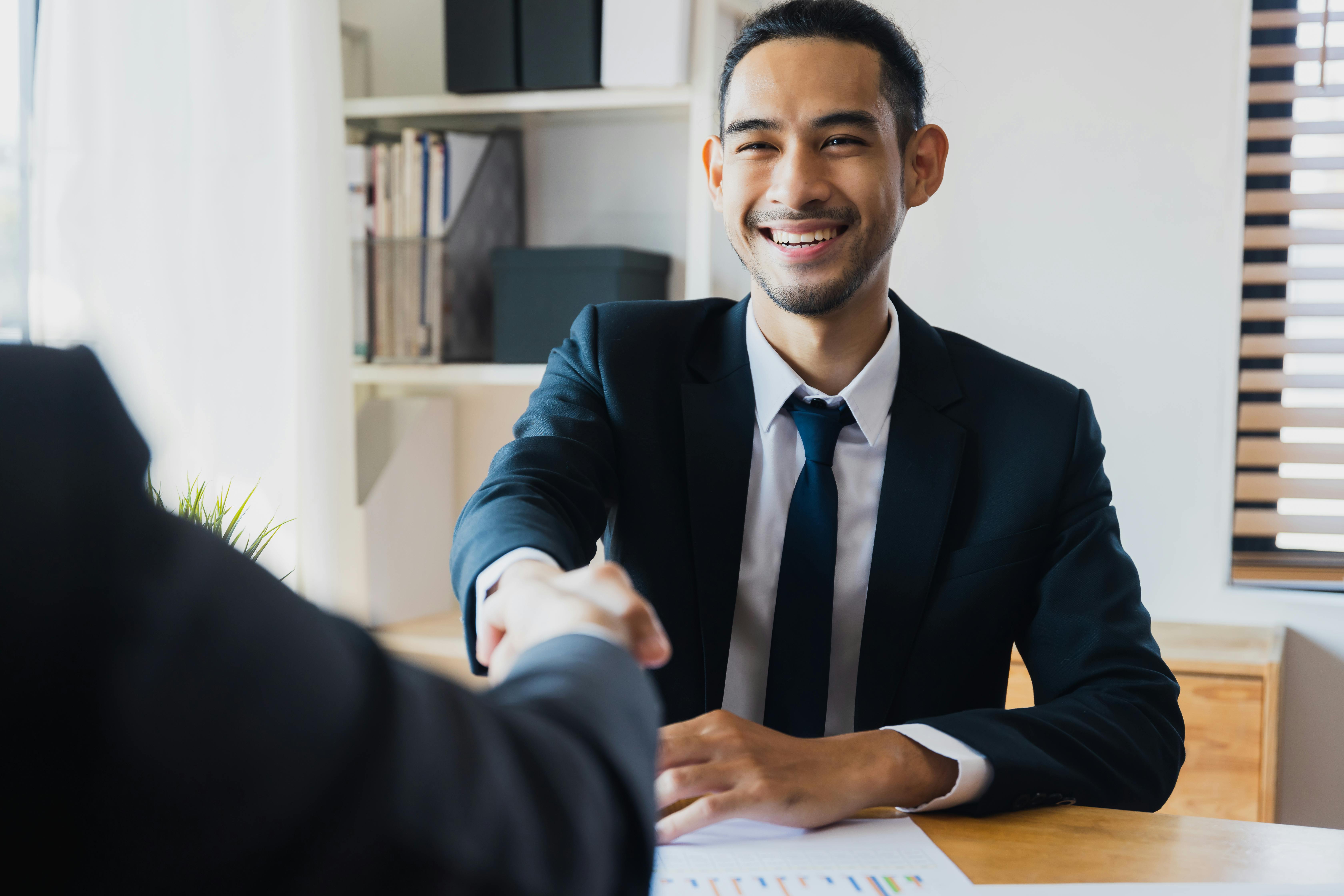 Successful negotiate and handshake concept two businessman shake hand with partner to celebration partnership and teamwork business deal